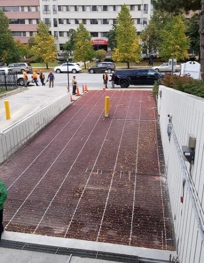 Heating cables installed in a parking garage ramp