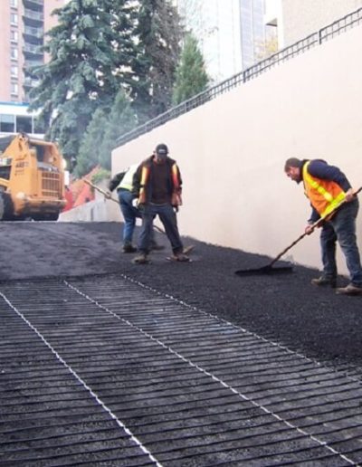 Asphalt installed over heating cables in parking garage ramp