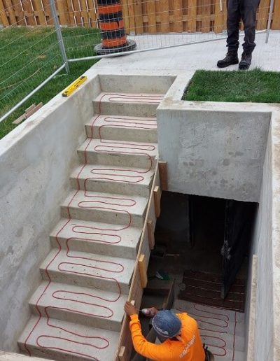 Heating cables installed in a parking garage stairwell